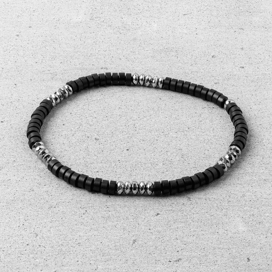 Our Black Onyx & Silver Bead Bracelet features black onyx and polished geometric stainless steel beads, finished off with our signature 'RG&B' engraved bead.